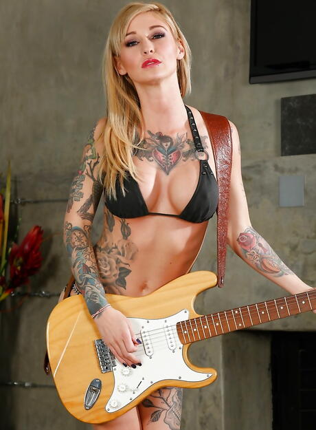 Enchanting american blond Kleio Valentien revealing big tits and hot ass in the bathroom